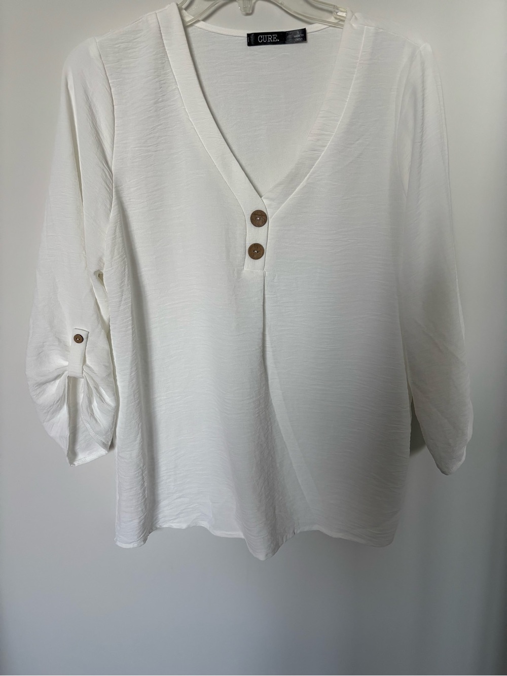 Cure White V-Neck Roll-Sleeve Blouse with Button Detail